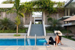Open House by StayVista - Nestled in nature, featuring a Swimming pool & Expansive lawn for a serene retreat